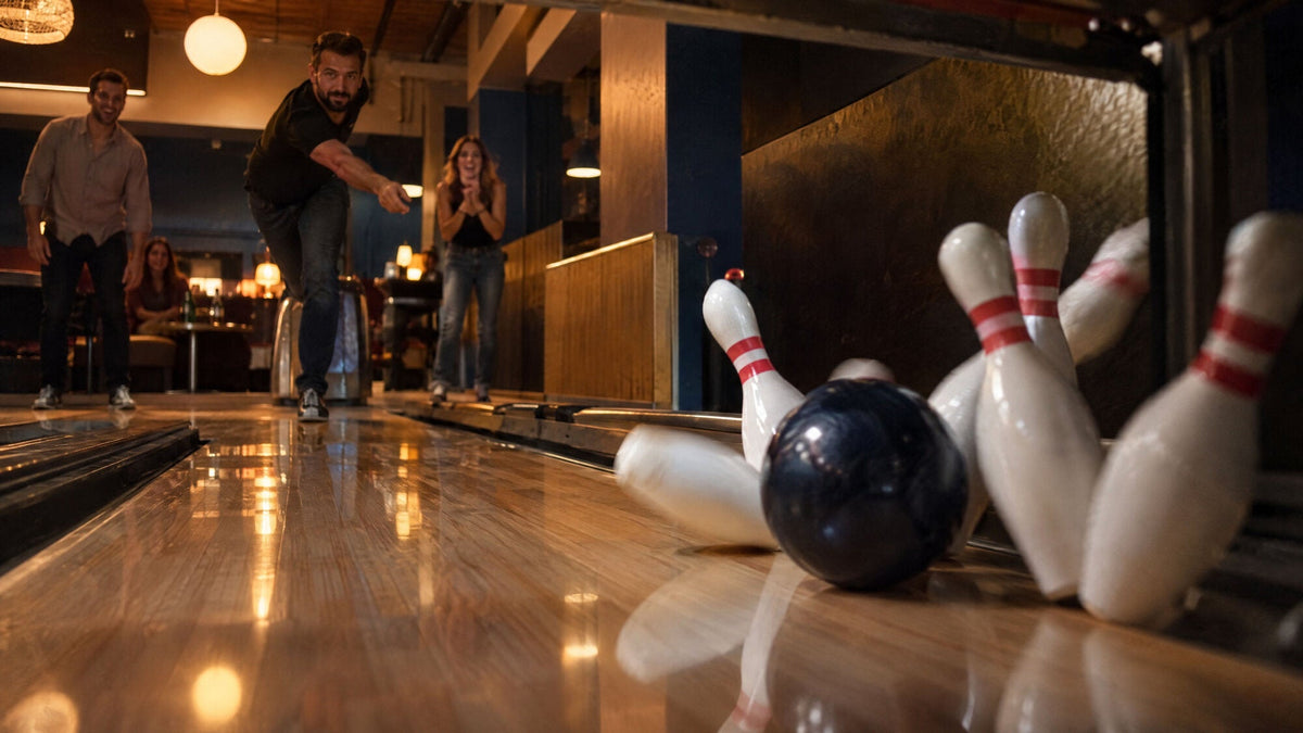 Ball hitting the pins, pins flying off the deck
